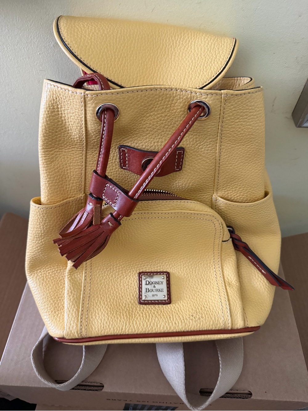 Dooney & Bourke Yellow Pebbled Leather Drawstring Backpack with Brown Trim